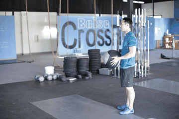 Medicine Ball Overhead Throw exercise demonstration targeting Shoulders