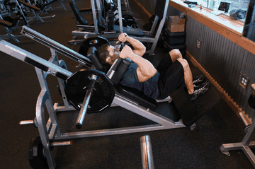 Narrow Stance Hack Squats exercise demonstration targeting Quadriceps