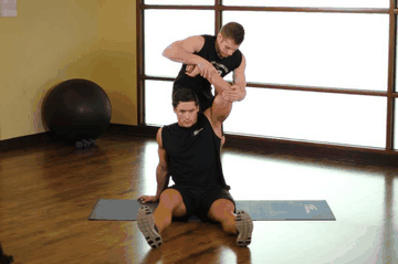 Overhead Triceps Stretch exercise demonstration targeting Triceps