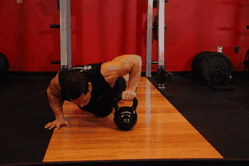 Plyo Kettlebell Pushups exercise demonstration targeting Chest