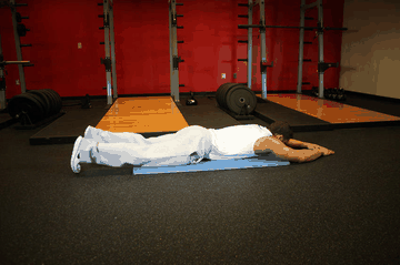 Superman exercise demonstration targeting Lower Back