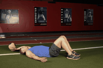 Supine One-Arm Overhead Throw exercise demonstration targeting Abdominals