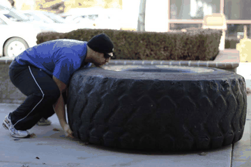 Tire Flip exercise demonstration targeting Glutes