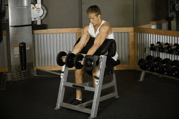 Two-Arm Dumbbell Preacher Curl exercise demonstration targeting Biceps
