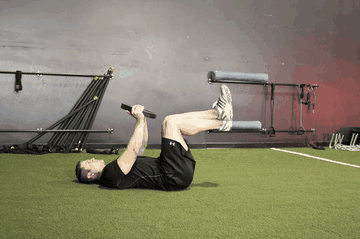 Weighted Crunches exercise demonstration targeting Abdominals